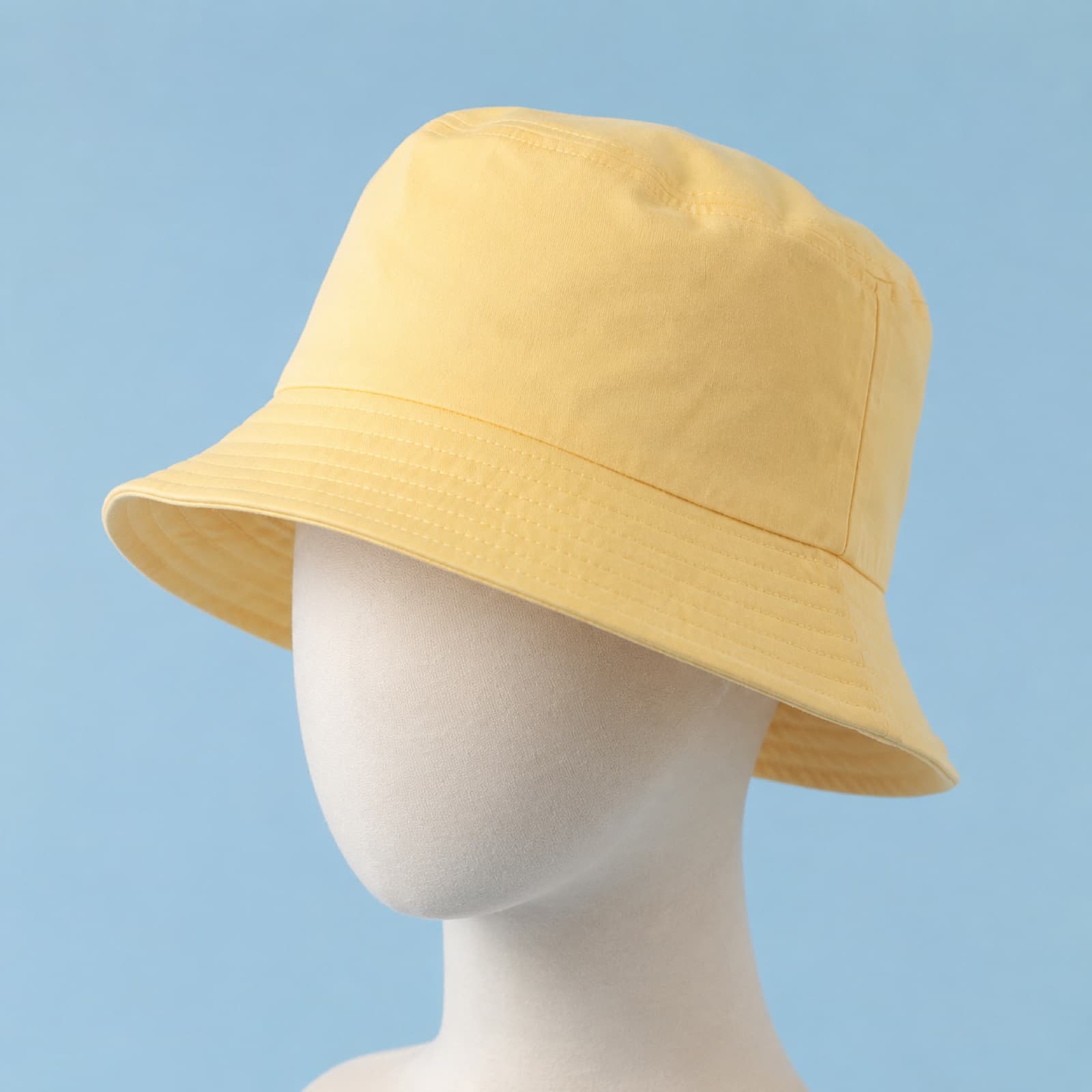 Butter-yellow toddler bucket hat with a wide brim
