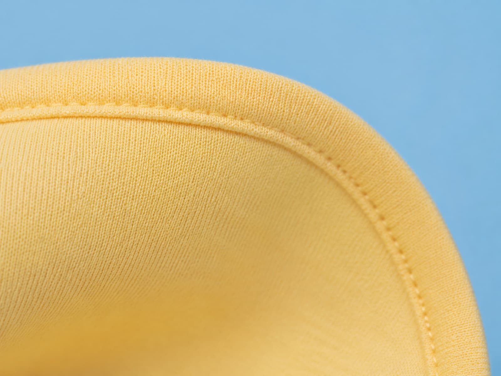 Macro photograph of a bound seam with even stitching and no loose threads