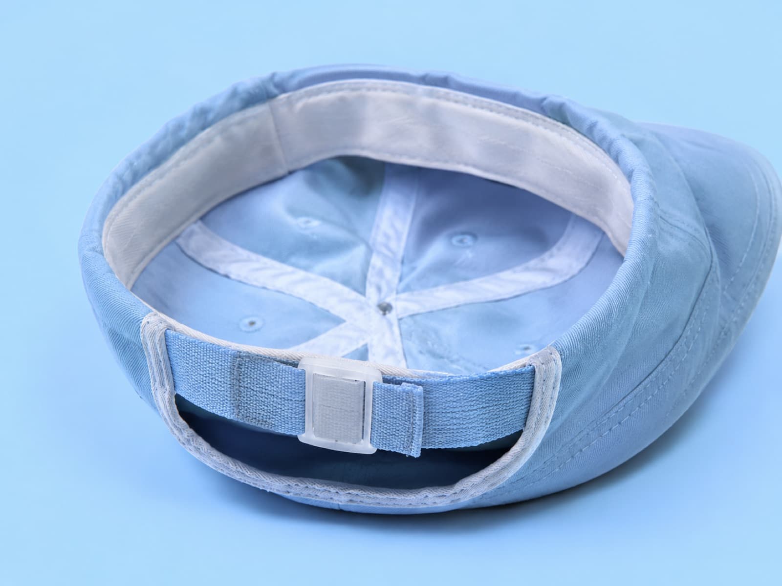 The junior hat turned inside out to show the adjustable inner band